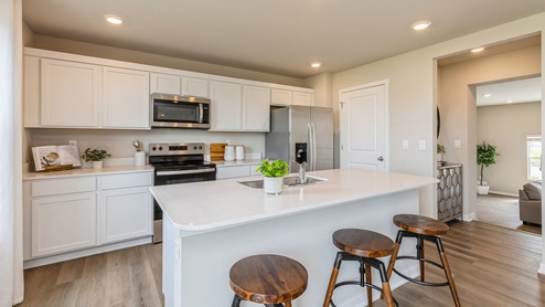 Kitchen with quartz countertops and stainless-steel appliances