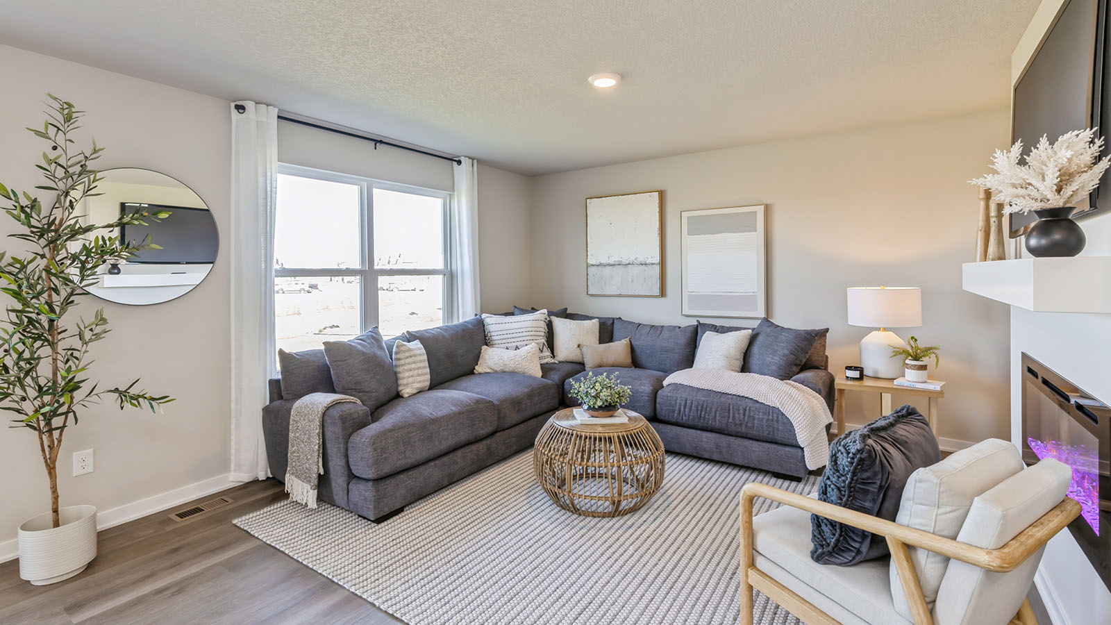 Bright Bellhaven living room with large window and overhead lighting