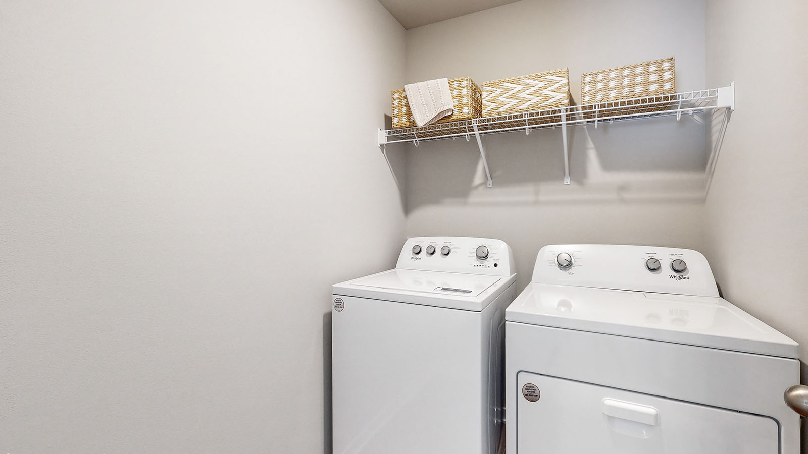 Laundry room with washer and dryer and shelving