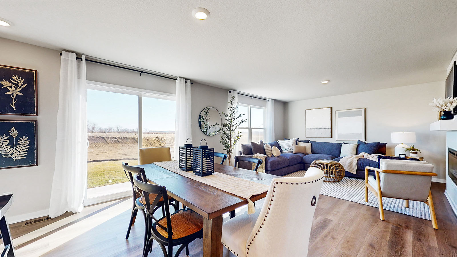 Open concept of dining, kitchen, and living area.