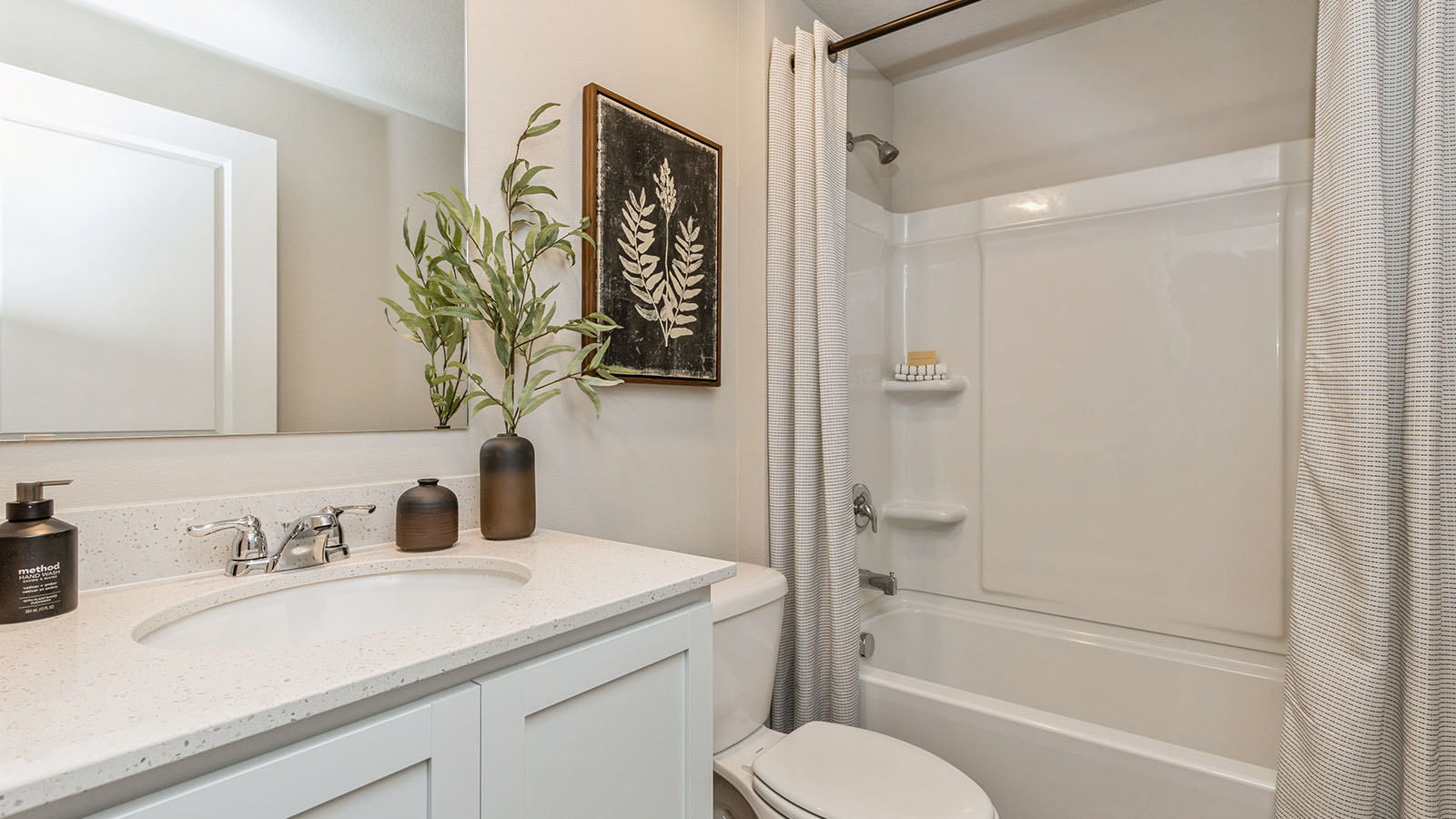 Bathroom with a sink, toilet, and shower tub.