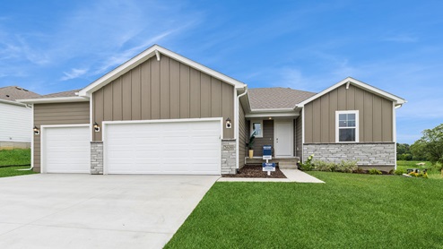 exterior of reagan model home with 3 car attached garage