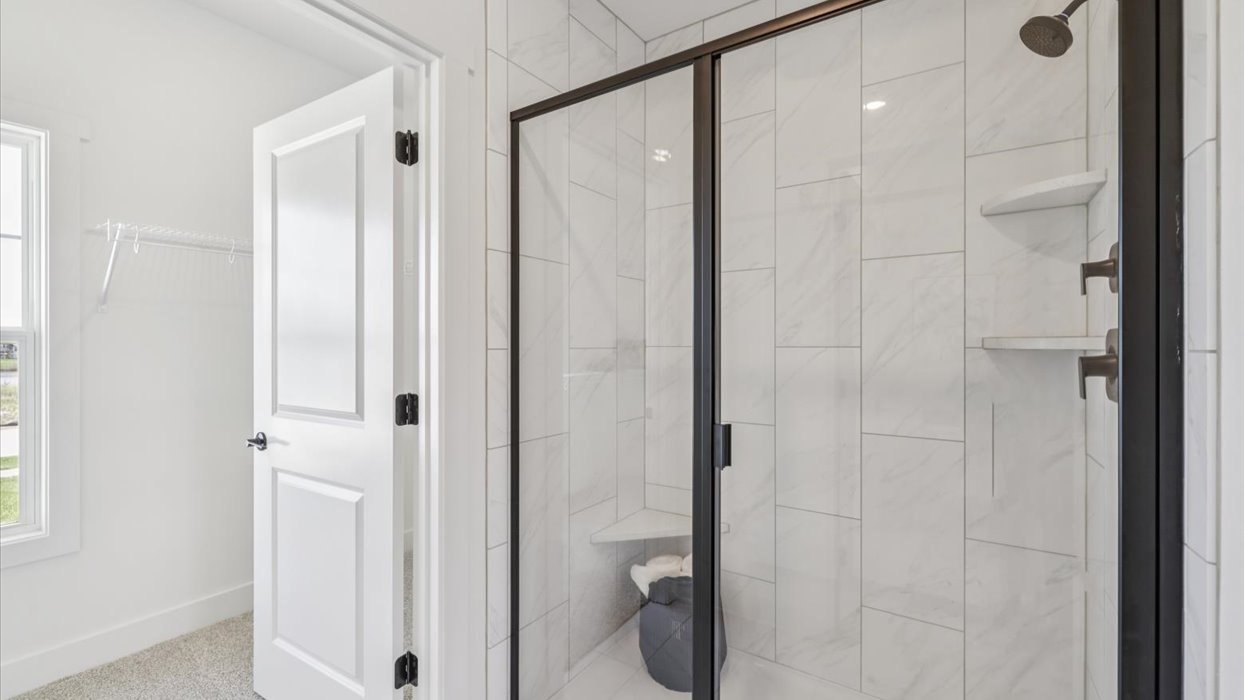 glass shower in primary bathroom
