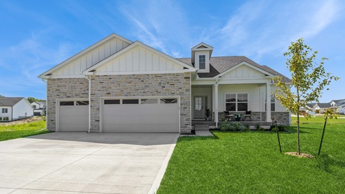 front exterior of lincoln model home with 3 car attached garage