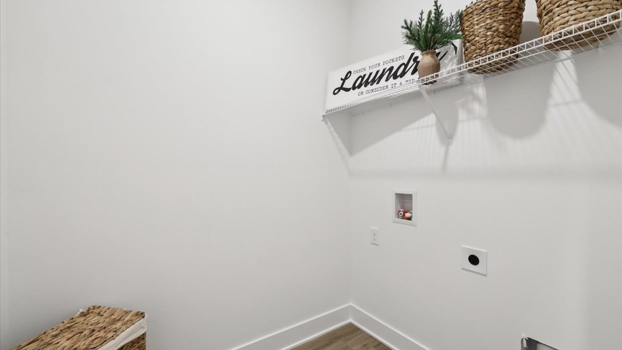 laundry room with white wire shelving