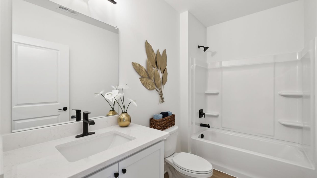 third bathroom with shower and bathtub