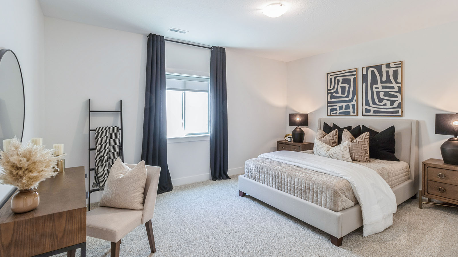 Third bedroom in finished basement with egress window with bed and desk