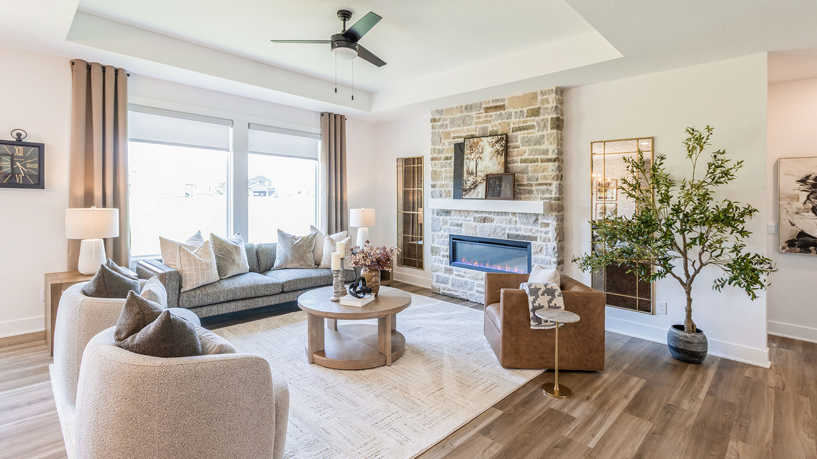 Lincoln living room with tray ceiling and electric fireplace and large window