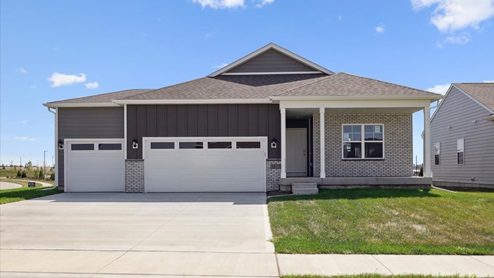 front exterior of hamilton home with 3 car attached garage