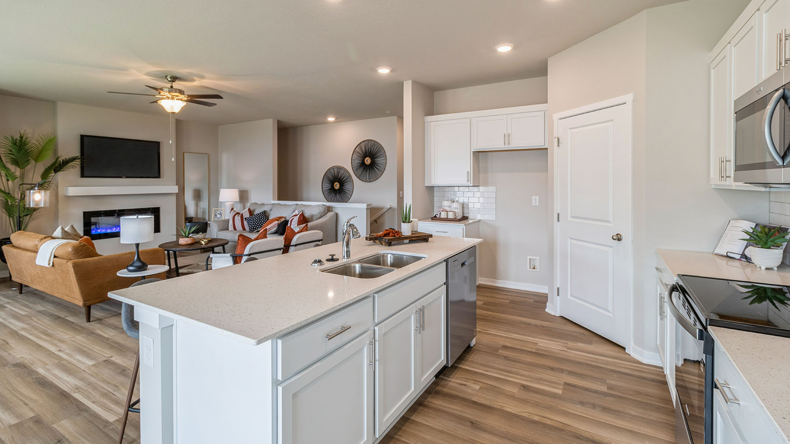 kitchen island with dual sink overlooking large living room