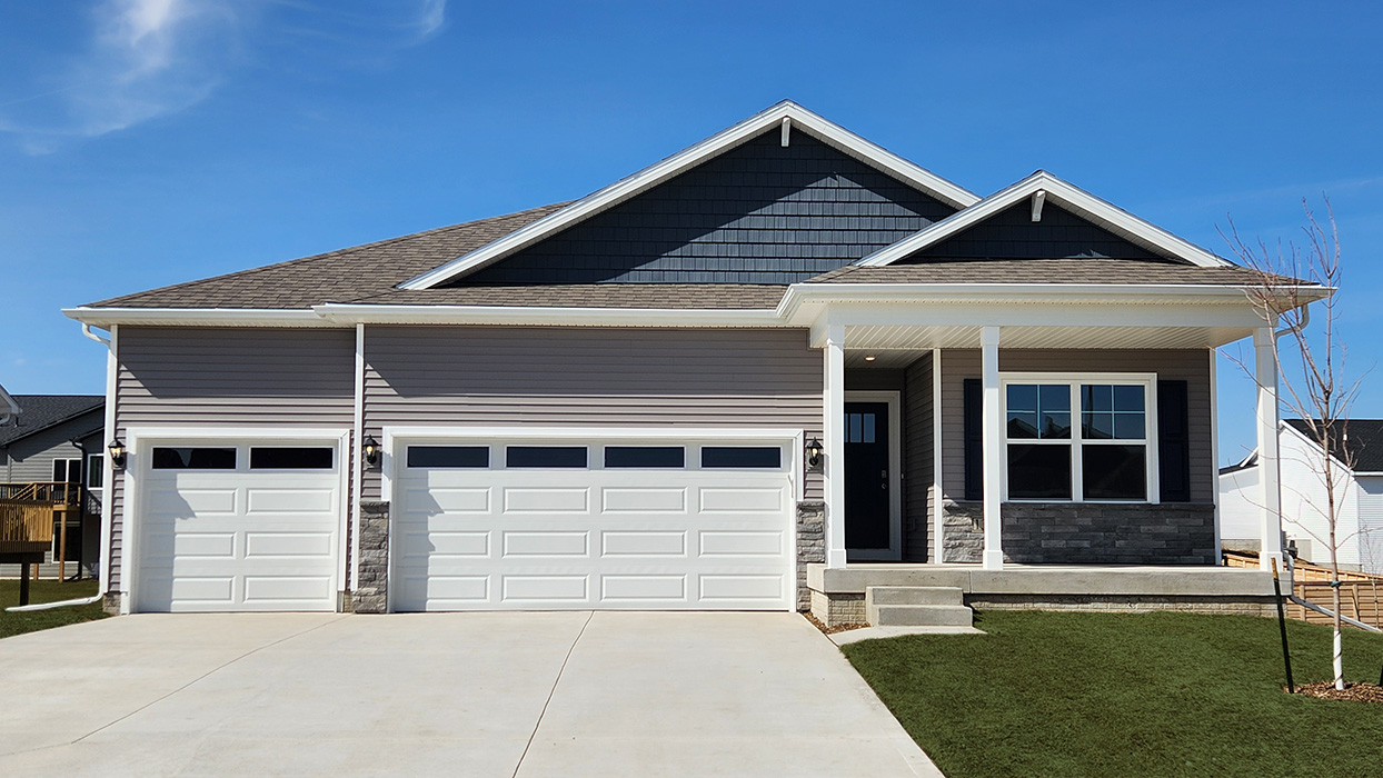 front exterior of ranch style home with 2 car attached garage