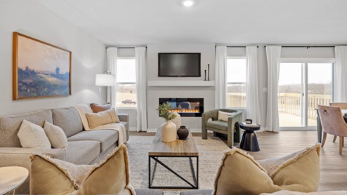 Cozy living room with tv mounted and electric fireplace