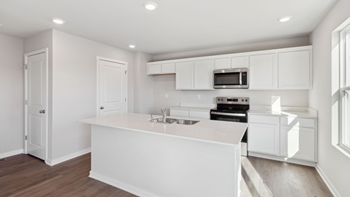 kitchen with white cabinetry and stainless-steel appliances