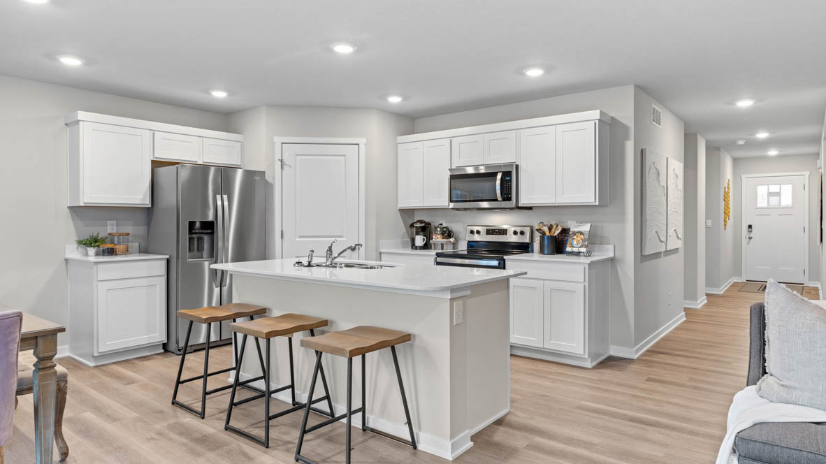 Open kitchen with stainless-steel appliances