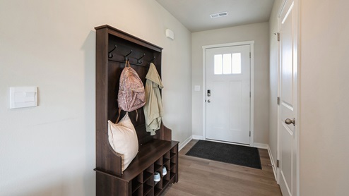 Front entryway of Sydney townhome with hall tree