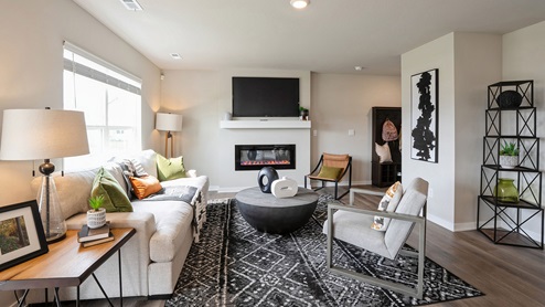 Cozy living room with window and overhead lighting
