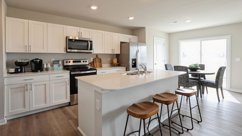 Modern kitchen with island and wood barstools