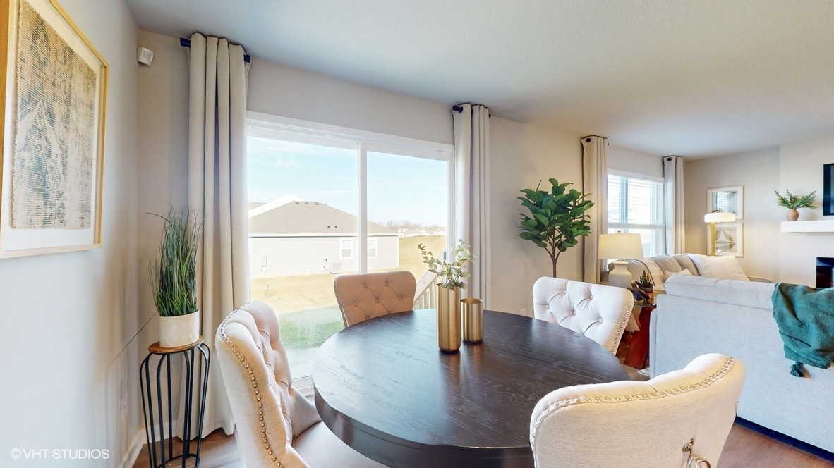 Dining area next to sliding glass doors to patio