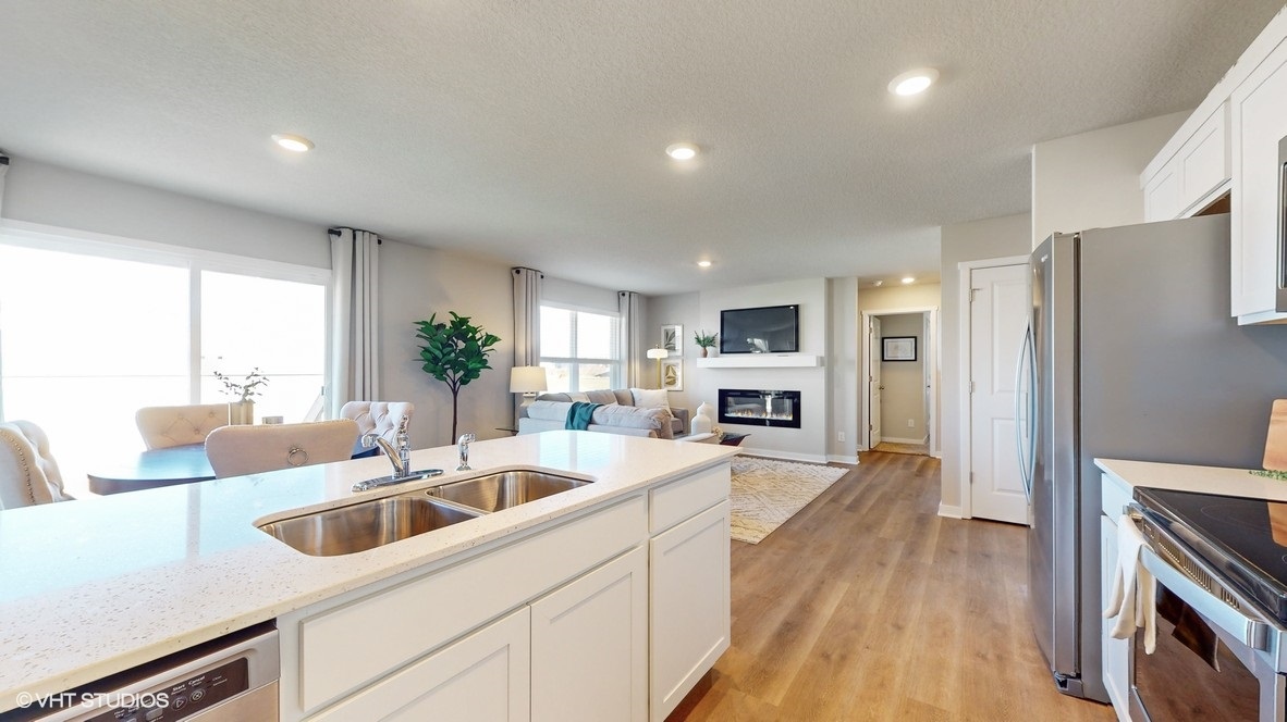 Kitchen overlooking living room and dining area