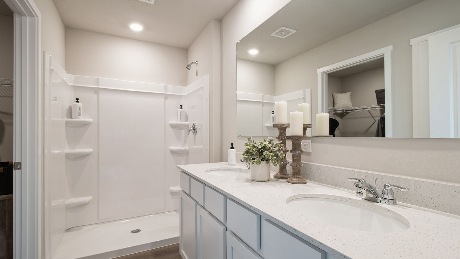 Large primary bathroom with large mirror and dual sinks