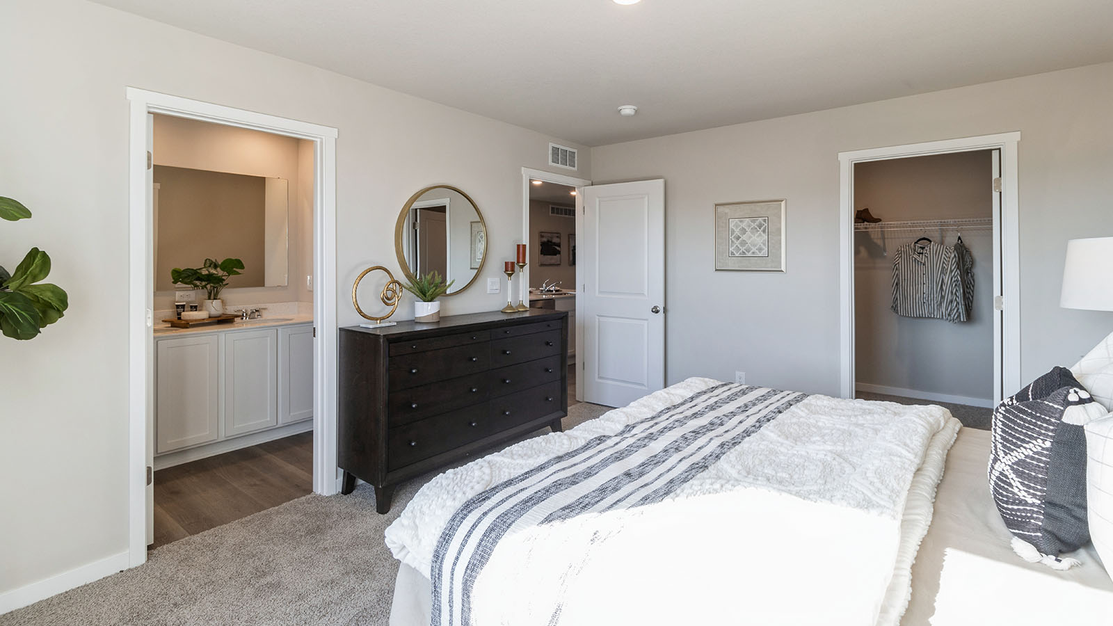 Primary bedroom designed with privacy and space in mind with a flow into a spa-inspired ensuite bathroom and walk-in closet