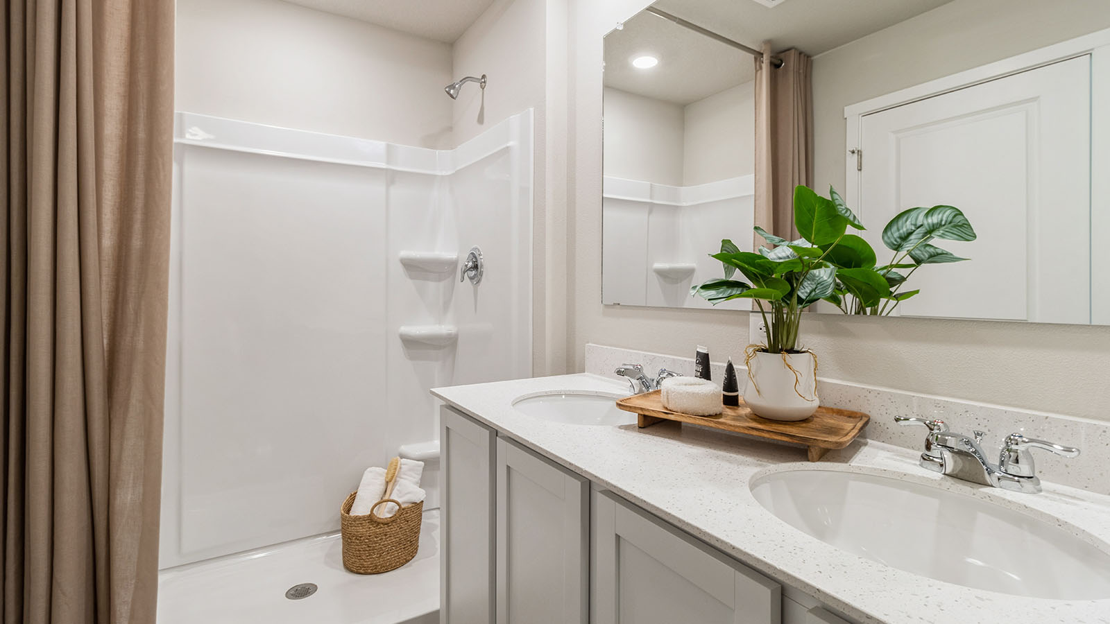 Owner’s ensuite in a new build home offers function and style with a walk-in closet, spa-like ensuite