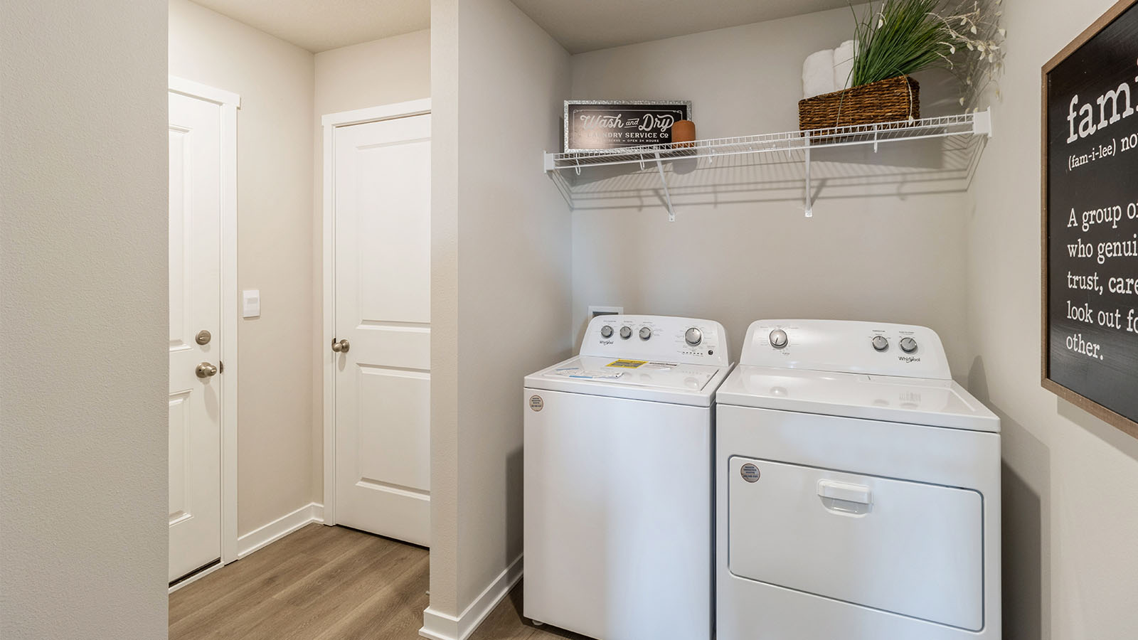 Highland Meadows utility laundry smartly designed with overhead organized storage, a drop zone, with new washer, dryer included
