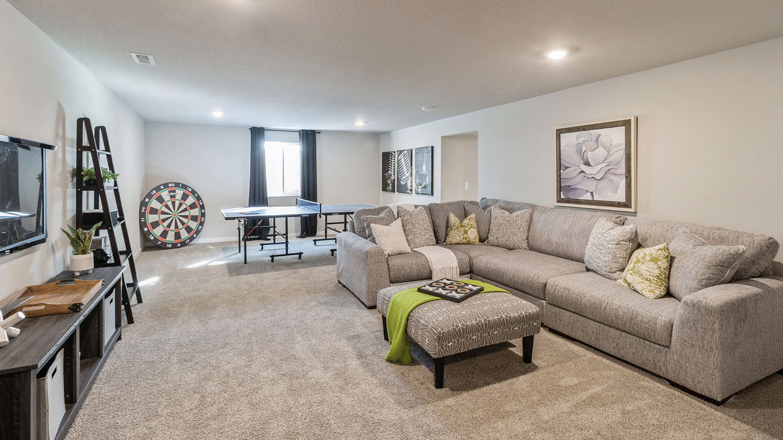 Finished basement flex space with quality flooring, open layout for study, crafts, game or family room use in Highland Meadows