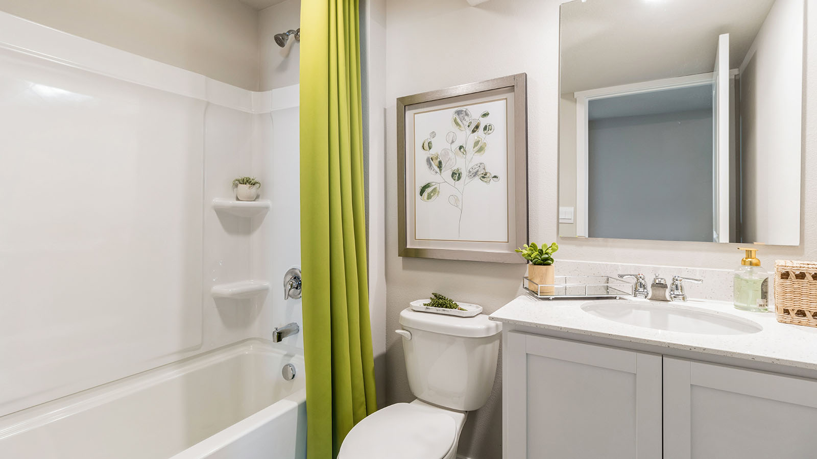 Second bath with built-in tub-shower combo, vanity, sink, lighting, stylish finishes in Highland Meadows