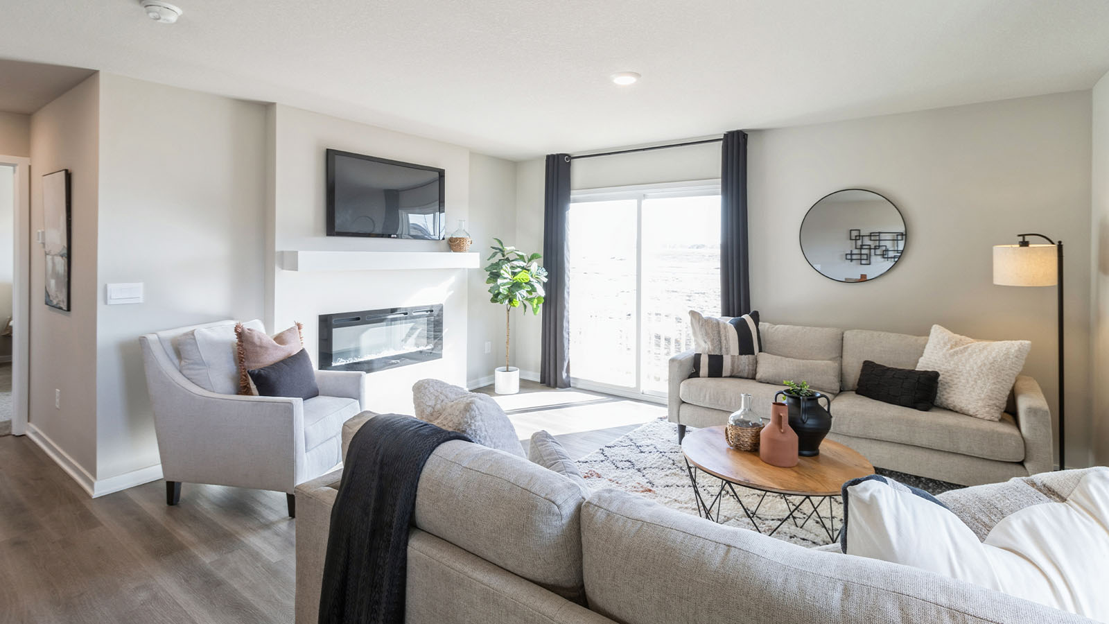 View from kitchen into the dining and living areas, backyard area, showing fresh open design at Highland Meadows