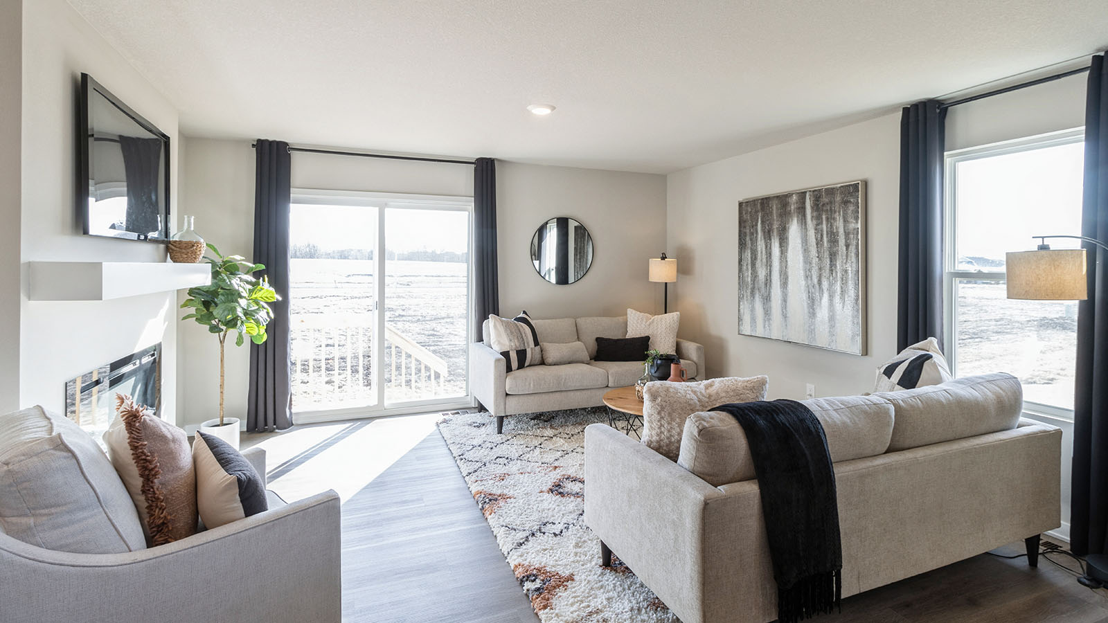 Spacious and bright Abbott living room with two couches and a chair