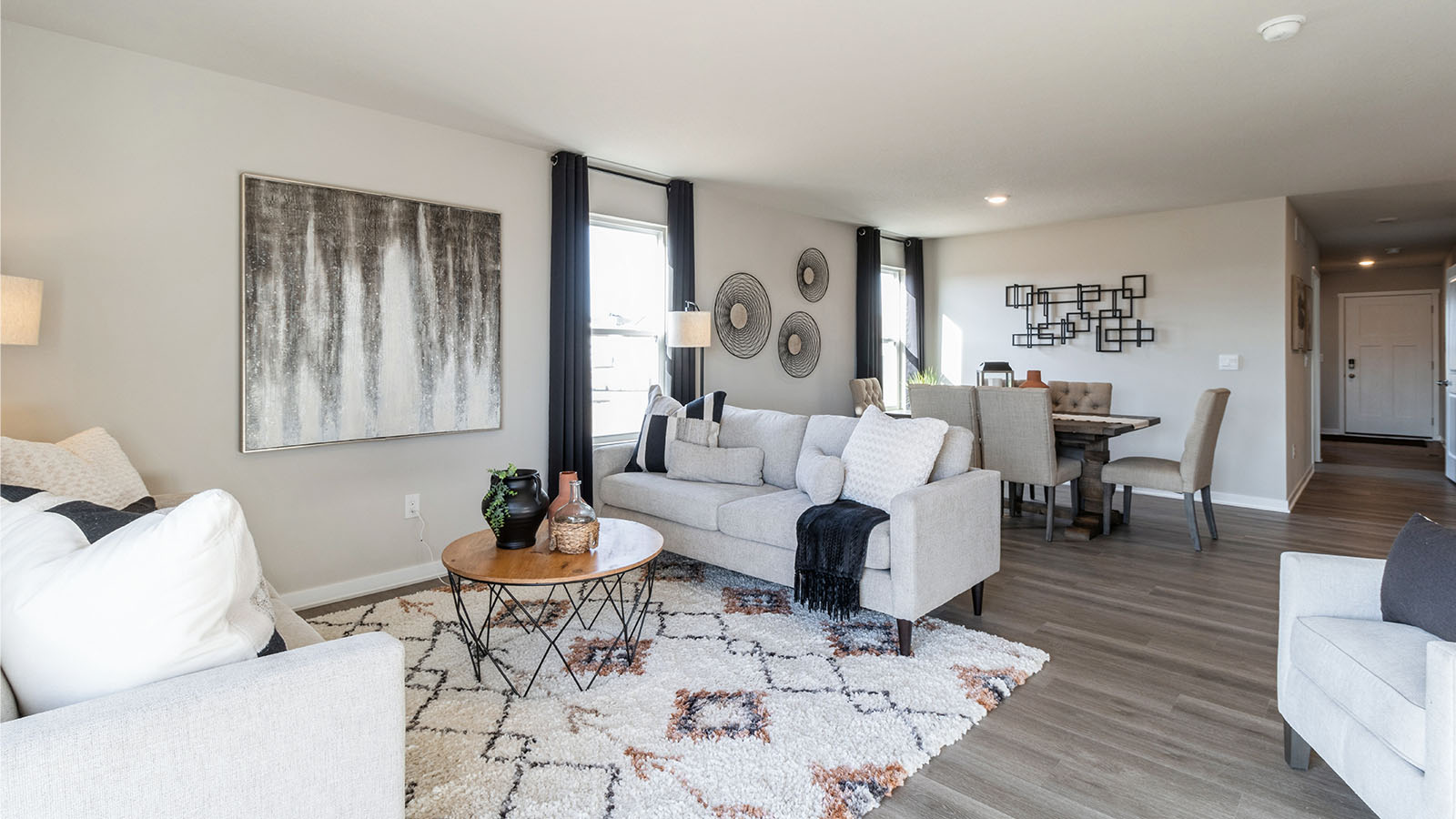 Open living room  with seating overlooking dining area