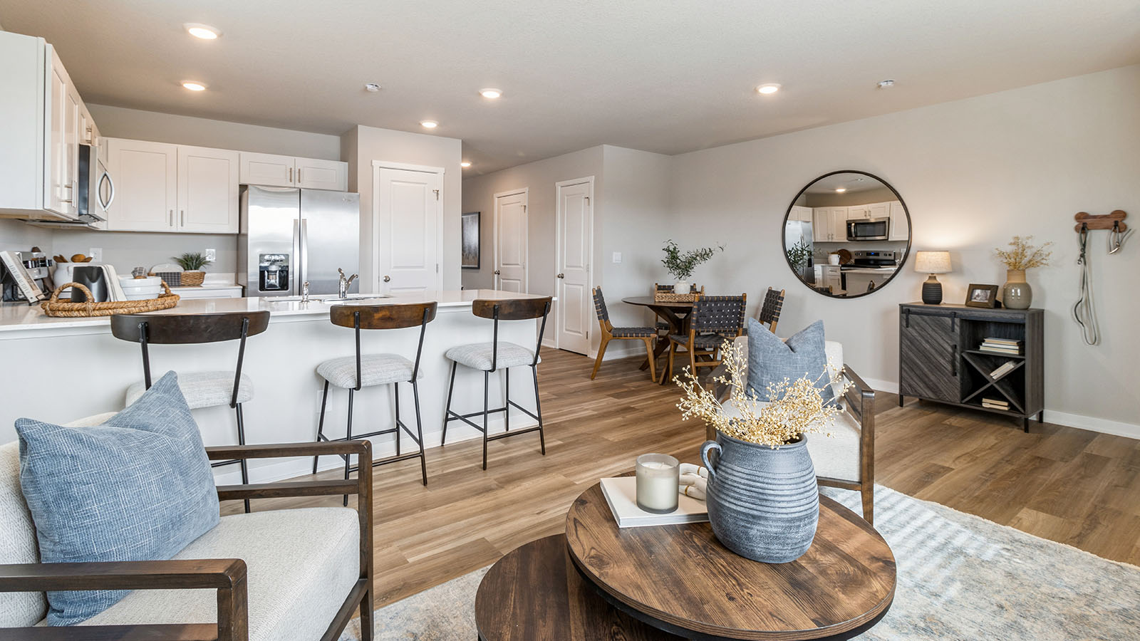 Living room overlooking dining area and modern kitchen