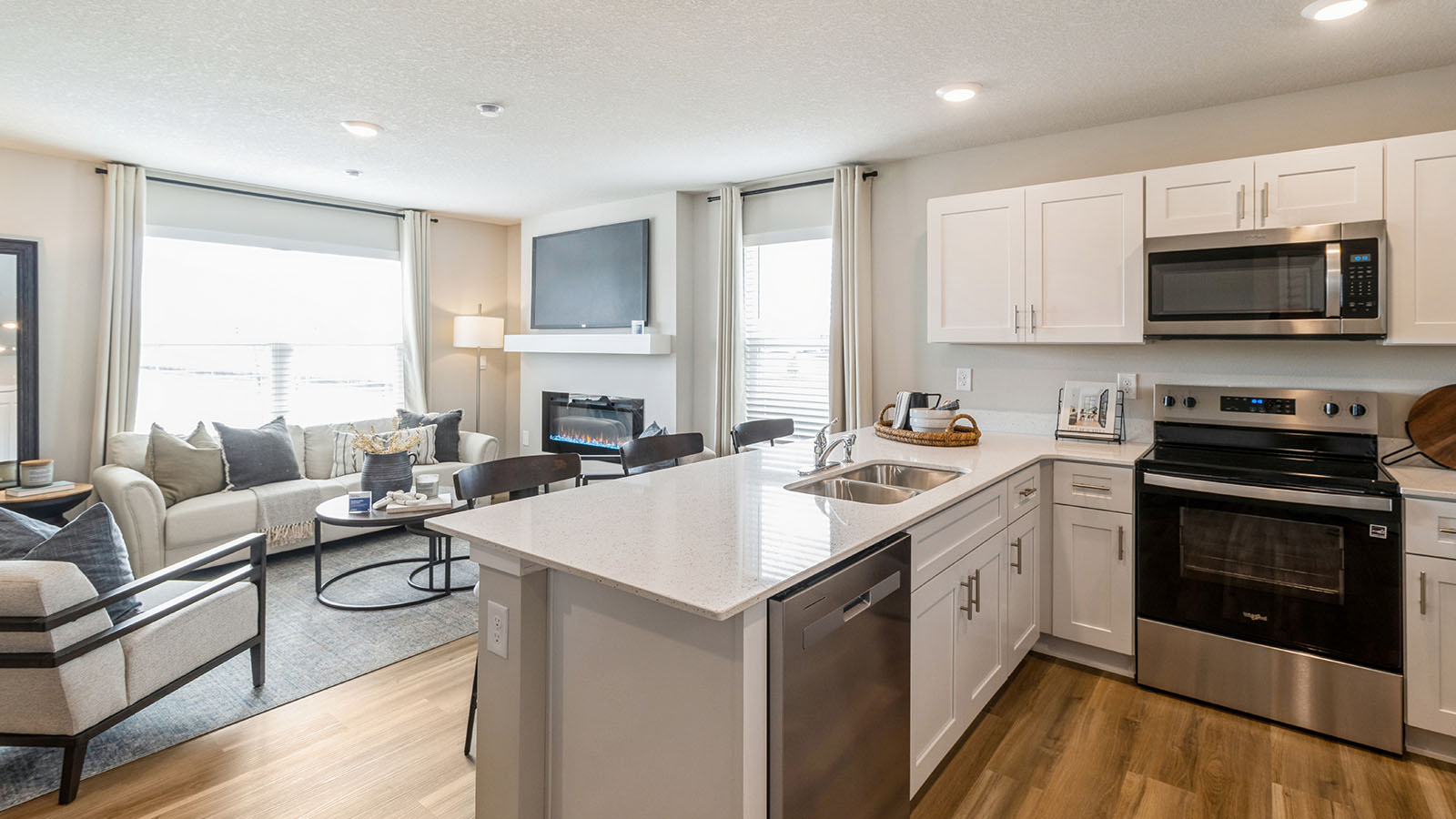 Spacious Pearson kitchen overlooking bright living room with large window