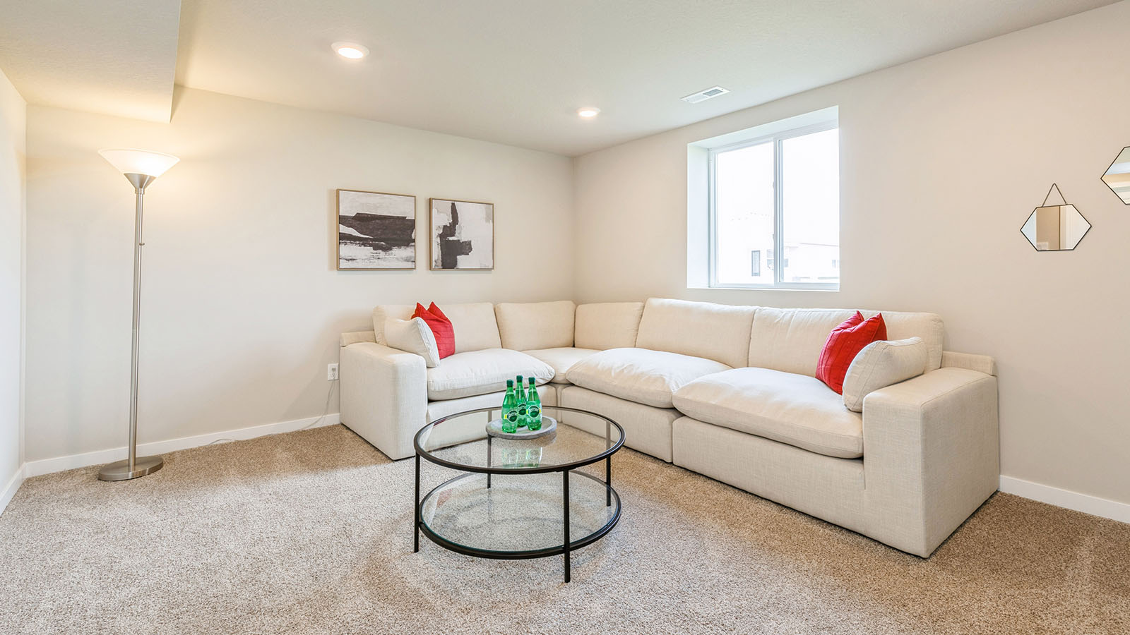 finished basement with window and white couch