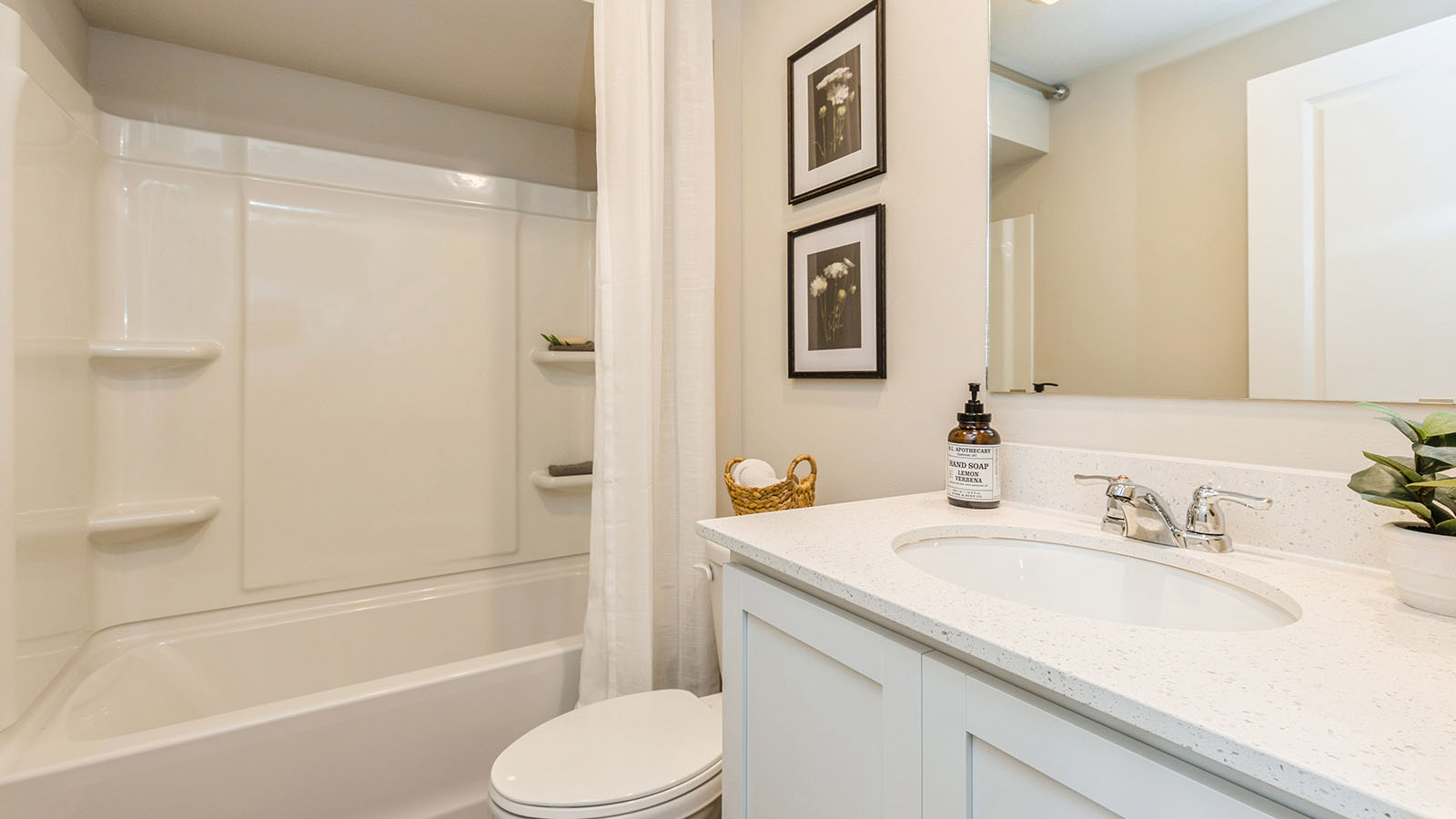 third full bathroom with a sink and bathtub