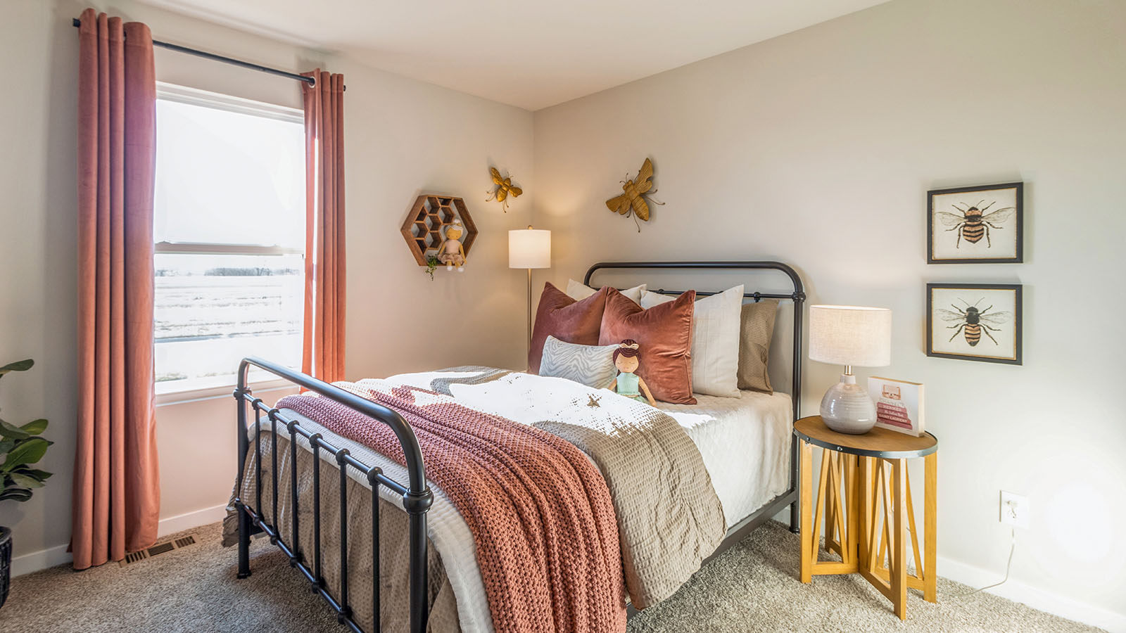 Second bedroom with pink bed and curtains