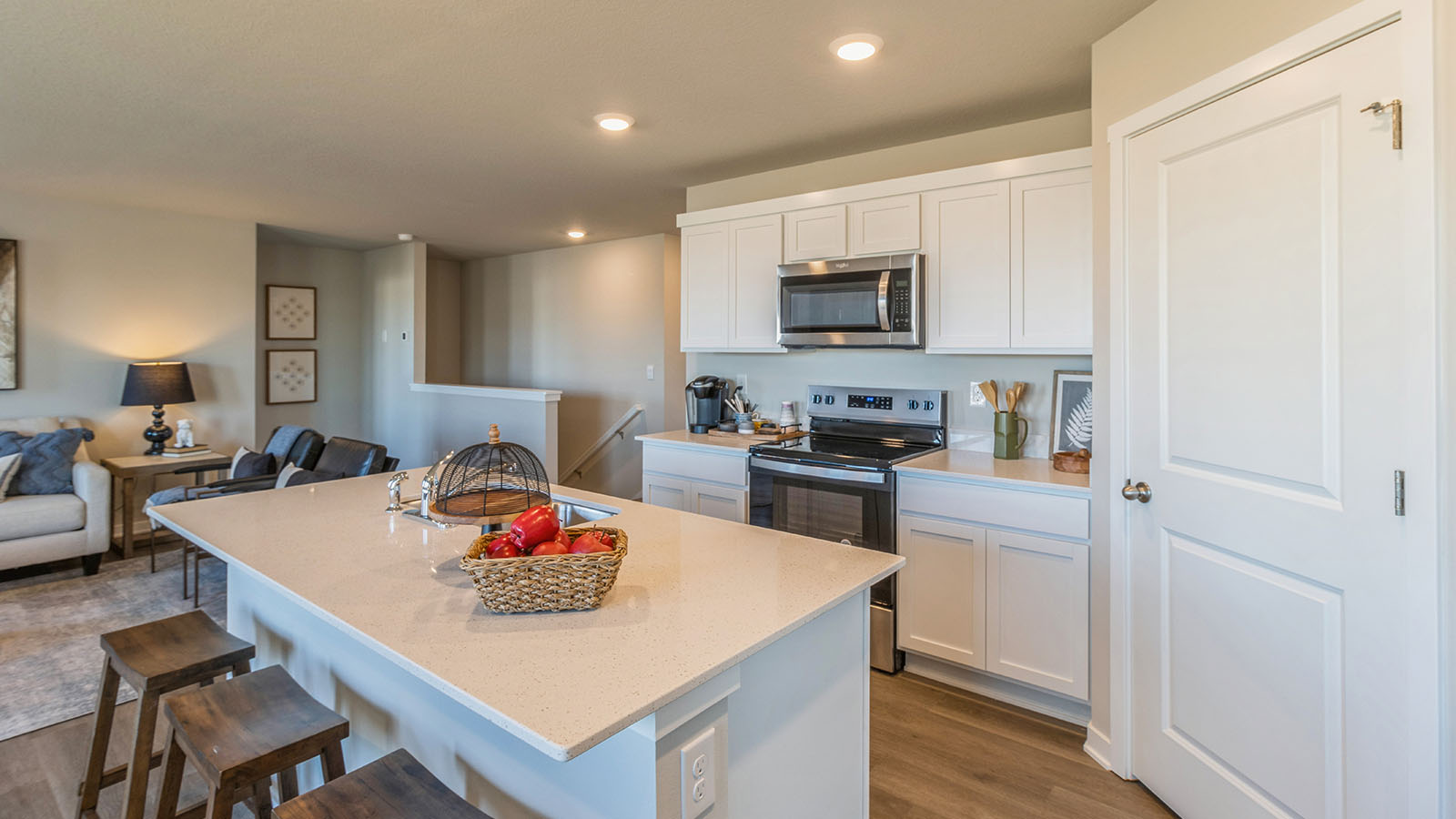 Side view of kitchen with island and quartz countertops