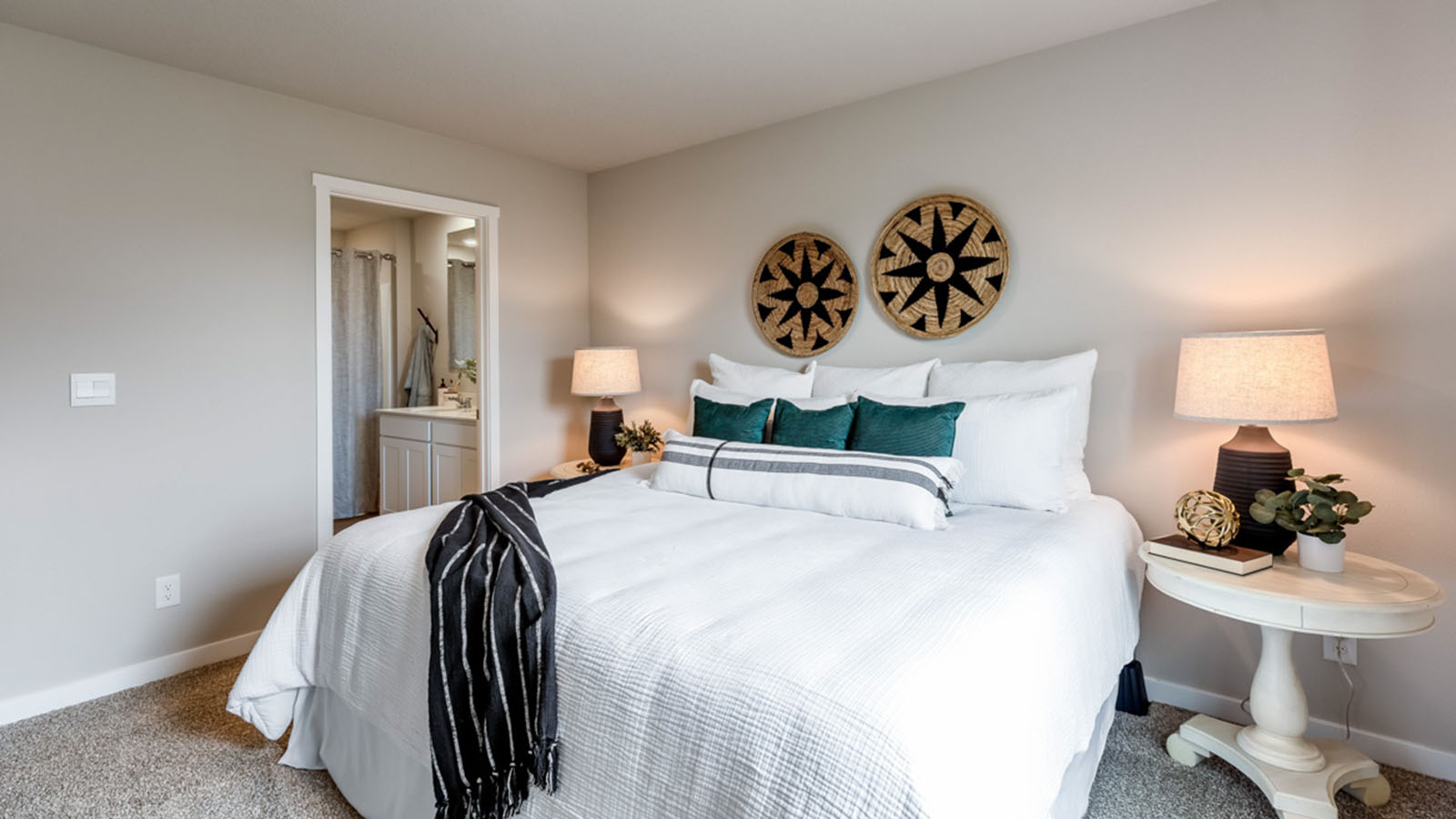 Primary bedroom with view of primary bathroom