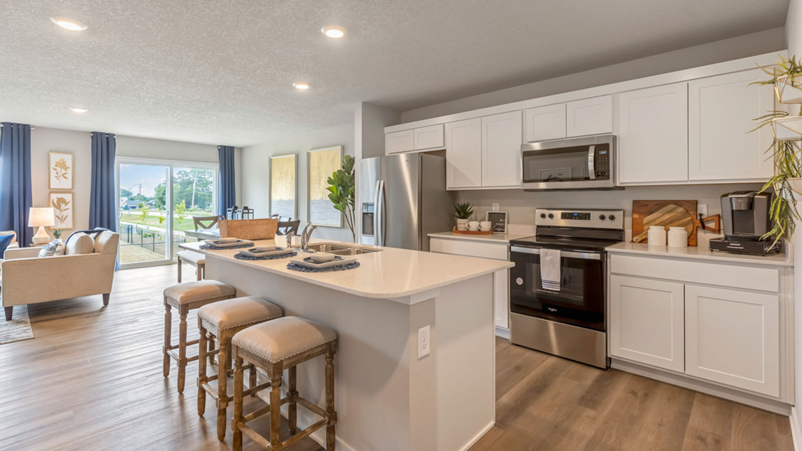 Kitchen with island and wooden barstools