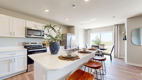Modern kitchen with island and wooden barstools