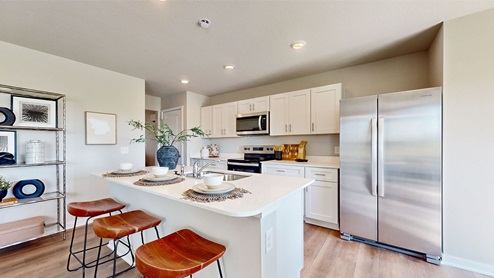 Kitchen with white cabinets and stainless-steel appliances