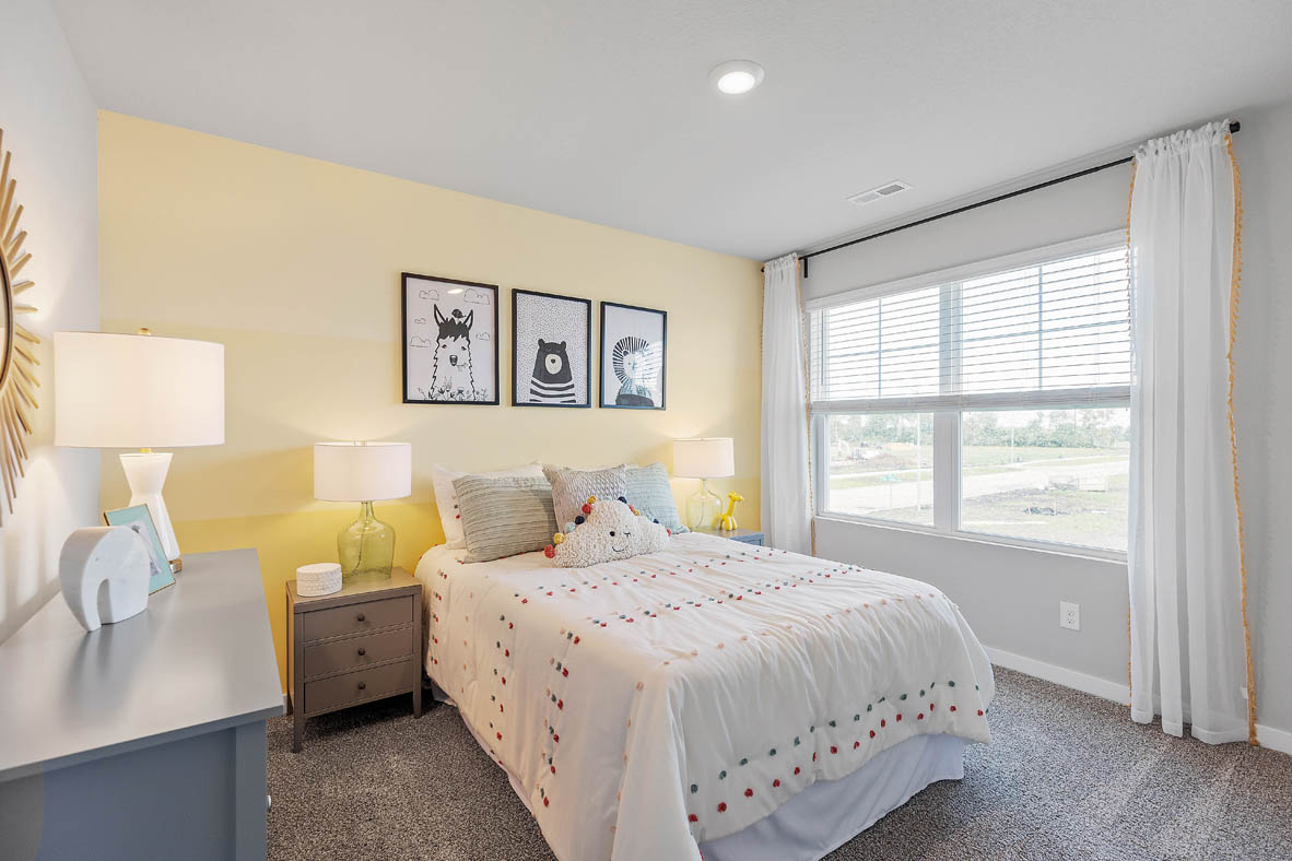 Third bedroom with dresser and window