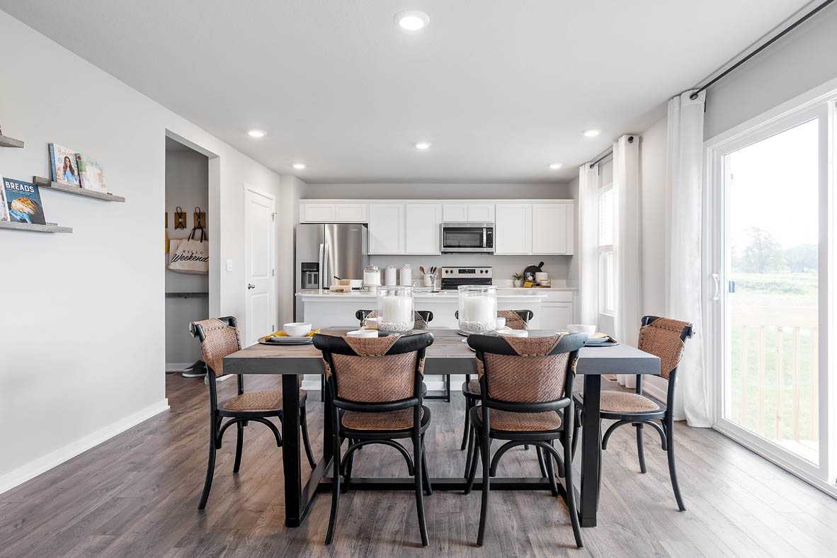 Dining area next to sliding glass doors and patio