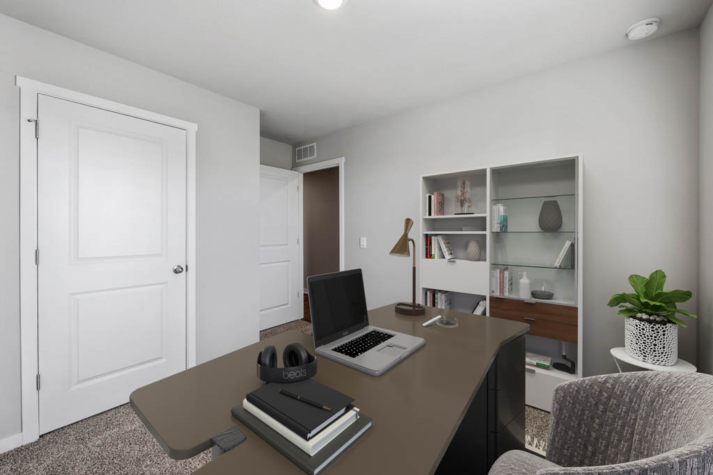 third bedroom staged as an office with desk
