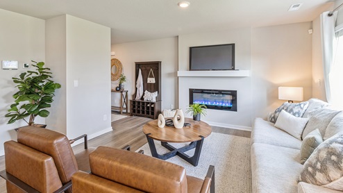 Living room with mounted tv and electric fireplace