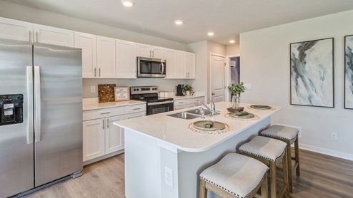 Kitchen with quartz countertops and stainless-steel appliances