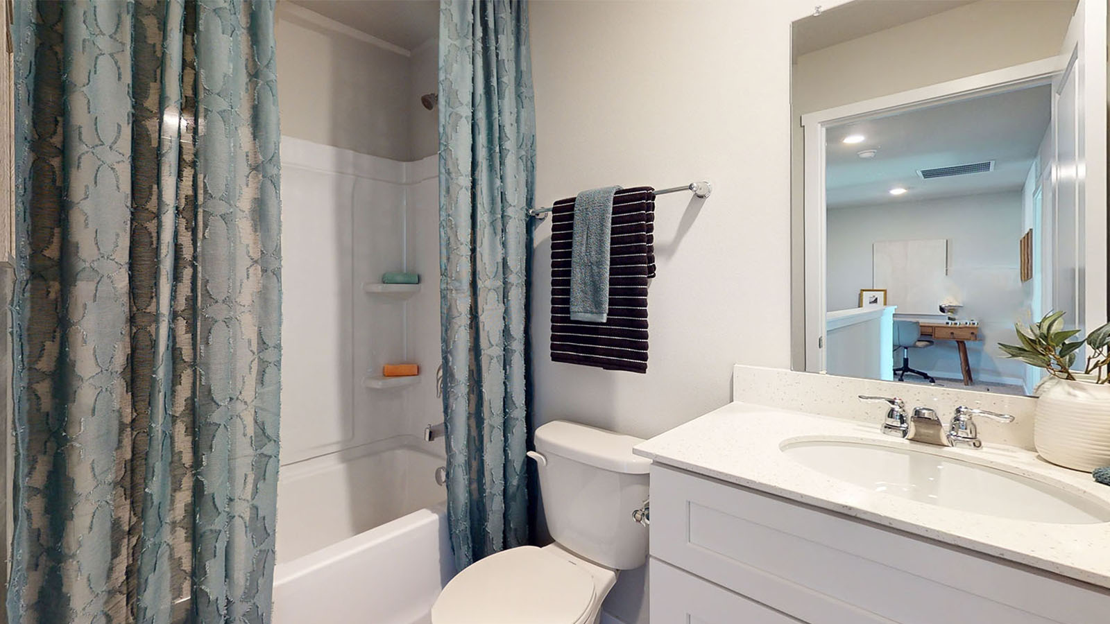 first bathroom with shower and bathtub