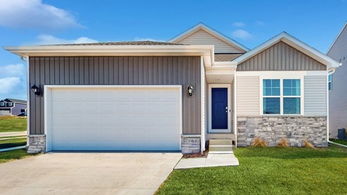 front exterior of ranch home with 2 car attached garage