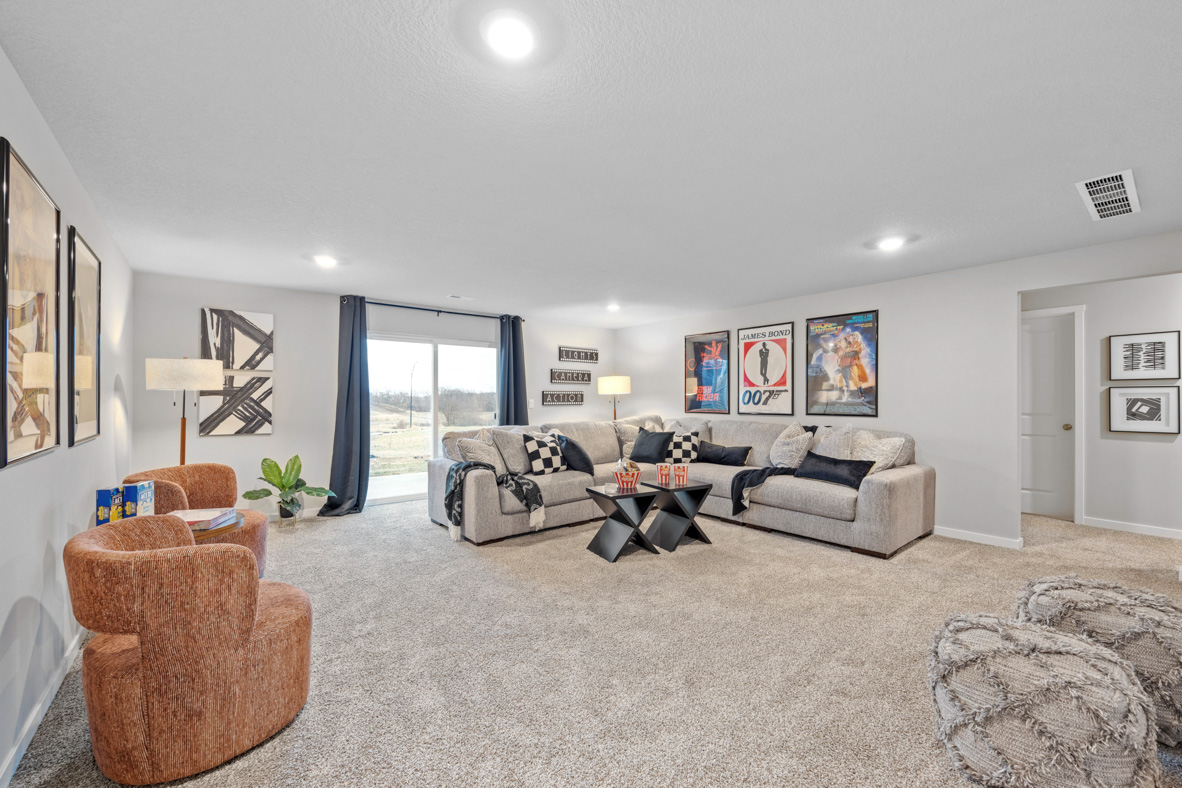 Basement-level recreation room with sliding doors that lead into the back yard.